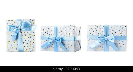 Gift boxes. Three wrapped Christmas gifts with light blue ribbons isolated on white background. Christmas gift boxes Stock Photo