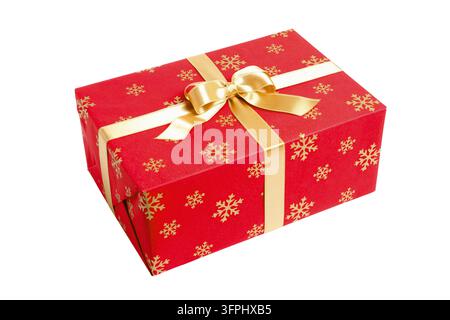 Gift box. Present wrapped in red paper with golden ribbon and snowflakes isolated on white background. Red gift box Stock Photo