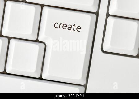 Enter key with create text symbolizing digital creativity and content production - Photomontage Stock Photo