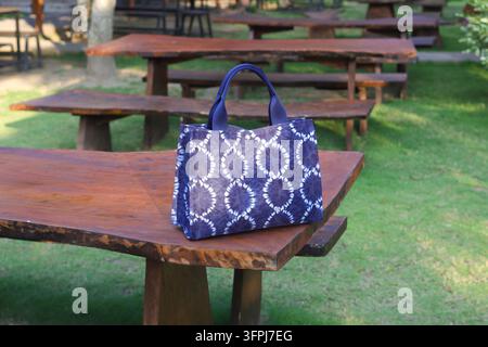 Indigo blue shoulder bag made from fabric with tie dye and shibori dyeing techniques Stock Photo