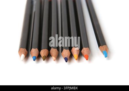 Colored pencils lined up on white background. Color pencils isolated on white. Stock Photo