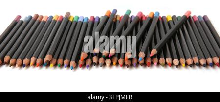 Colored pencils lined up on white background. Color pencils isolated on white. Stock Photo