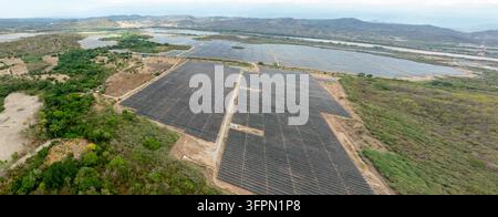 Aerial view of the Puerta de Oro solar photovoltaic park featuring massive arrays of solar panels set within a rural landscape with rolling hills in G Stock Photo