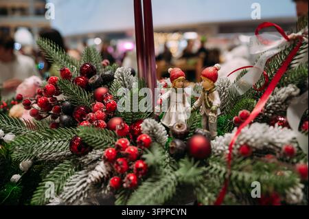 Christmas holiday arrangement with festive ornaments, evergreen branches and decorative figures Stock Photo