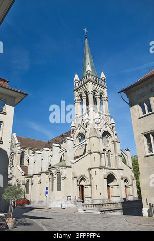 Facade and Steeple of Historic Church of Saint Peter and Paul in Old Town Bern Switzerland Stock Photo