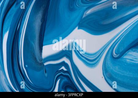Vibrant blue and white fluid art abstract background with dynamic marble waves and patterns Stock Photo