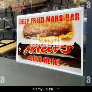 Deep Fried Mars Bar sign delicacy for sale in a Scottish Fish and Chip shop, UK Stock Photo