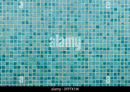 Turquoise Glass Mosaic Tile Wall Texture, Small Square Aqua Blue Green Tiles with Beige Grout Full Frame Background Stock Photo