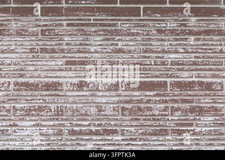Brown Slim Brick Veneer Wall with Whitewashed Dry Brushed Finish, Long Narrow Linear Bricks in Mixed Height Horizontal Courses Stock Photo