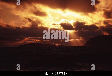 SUNLIGHT STREAMING THROUGH DARK STORM CLOUDS OVER WILLIAM BAY NATIONAL PARK IN WESTERN AUSTRALIA. Stock Photo