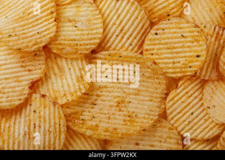 Lots of potato chips, texture close up Stock Photo