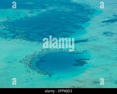 Aerial drone of atoll with a coral reef and clear turquoise water. Borneo, Malaysia. Stock Photo