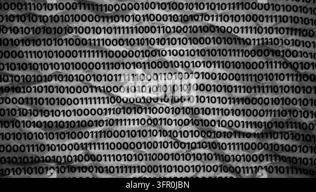 A textured background of crumpled paper covered with rows of repeating binary code. Black and white. Close up. Stock Photo