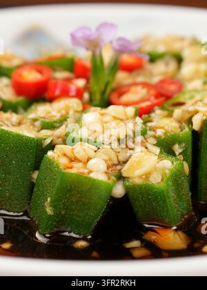 Extreme Close-Up Garlic Okra with Minced Garlic, Red Chili and Sauce Stock Photo