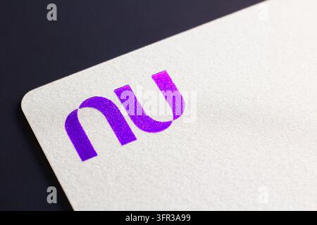 A close-up view of Nubank (Nu) credit card and a debit card seen ...