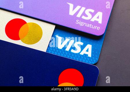 A close-up view of Visa Signature credit card and a debit card as seen ...