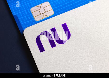 A close-up view of Nubank (Nu) credit card and a debit card seen ...