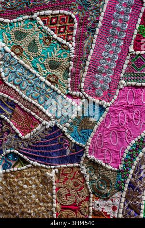 Full frame view of traditional rajasthan patchwork tapestry backdrop. Handmade ethnic textile background with embroidery, beads and sequins for bohemi Stock Photo