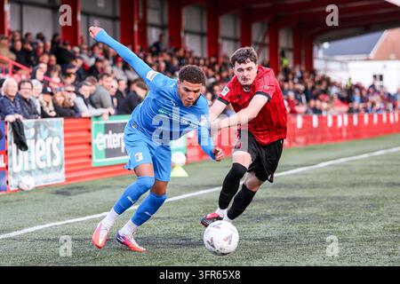 Vertical Intercept Example Barrow AFC #19 Arian Allen fires the ball across as Tamworth's #29 ...