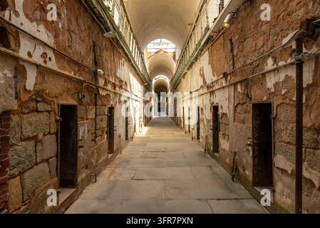 Interior view of the historic cell block corridors at Eastern State Penitentiary in Philadelphia, Pennsylvania. The former prison is known for its dis Stock Photo