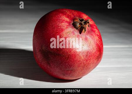 pomegranate on grey wood background Stock Photo
