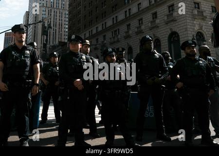 New York, New York, USA. 10th Oct, 2026. Members of the NYPD look on at protesters at an anti-ICE protest in Herald Square on October 10, 2026 in New York City. Protesters take to the streets following an incident where ICE agents shot a 28-year-old-man, Oscar Belgal while he in a vehicle with his 5-year old child in the Marble Hill neighborhood in the Bronx. (Credit Image: © Bryan Smith/ZUMA Press Wire) EDITORIAL USAGE ONLY! Not for Commercial USAGE! Stock Photo