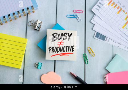Busy Does Not Mean Productive, Productivity Trap and Workplace Efficiency Concept with Bold Typography on Sticky Note Stock Photo