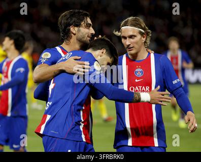 Mika Godts #22 of PSG celebrates his goal with Illia Zabarnyi #6 (left ...