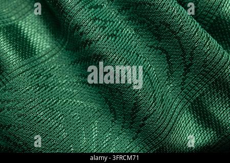 Dark Emerald Green Fabric Texture with Flowing Folds and Woven Pattern Close Up Stock Photo