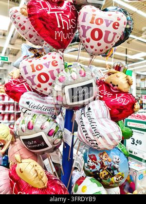 Kiel, Germany - 27. September 2023: Lots of balloons in heart shape for sale Stock Photo