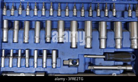 Mechanic socket wrench set with chrome vanadium sockets, bits and extension bars neatly organized in a blue plastic case for repair work. Bulgaria, va Stock Photo