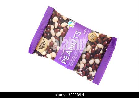 Iserlohn, Germany - September 20, 2026: A package of Choco Moment chocolate covered peanuts lying isolated on a white background. Stock Photo