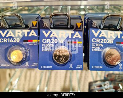 Kiel, Germany - June 18, 2025: Different Types of Varta Lithium Button Cell Batteries Hanging on Display in a Retail Store, Showcasing Various Model N Stock Photo