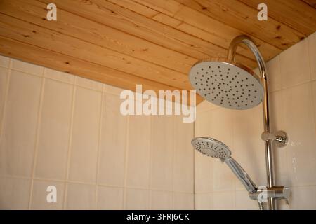 Showerhead provides soothing water flow in stylish bathroom. Stock Photo