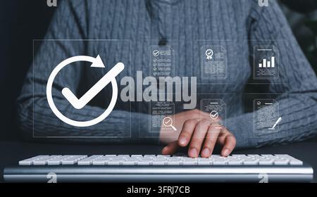 Document Approval and Quality Assurance Process Concept. Businesswoman working on computer with icons of document review and check mark, Stock Photo