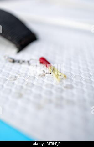 Close up of a small fishing lure on a paddleboard Stock Photo