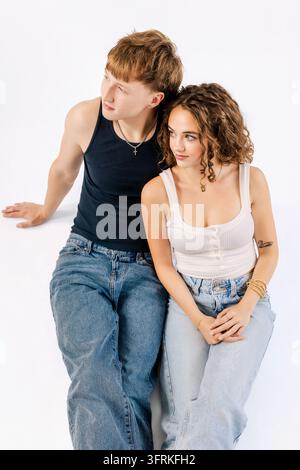 Stylish Gen Z couple posing on a white background Stock Photo