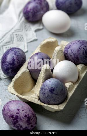 Happy Easter card. Naturally colored Easter eggs lying in the tray, selective focus Stock Photo