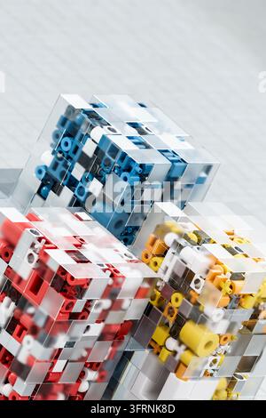 Abstract 3d digital data structure featuring modular blue, red and yellow components enclosed in transparent geometric cubes, symbolizing technology, Stock Photo