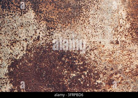 Rusty metal surface displaying heavy oxidation and decaying texture. Abstract grunge background with aged industrial elements Stock Photo