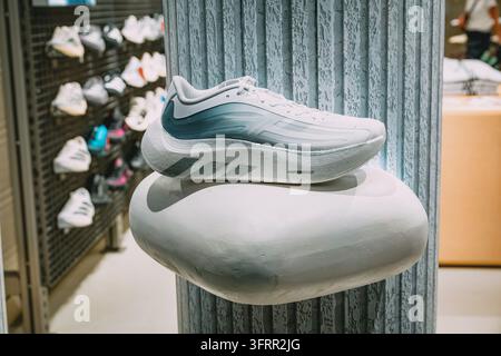 8 August 2026, Belgrade, Serbia: Adidas HYPERBOOST running shoe showcasing modern design and athletic footwear technology in a retail store environmen Stock Photo