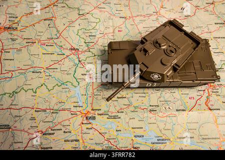 Flat lay of a vintage world map with retro camera, compass, and travel gear. Stock Photo
