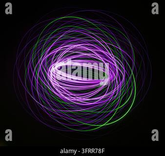 Purple and Green Neon Light Spiral Stock Photo