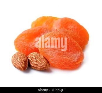 Dried apricots with sweet bone isolated on white backgrounds. Apricots with almonds Stock Photo
