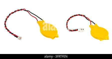 Yellow CMOS backup battery with twisted wires and pin connector Stock Photo
