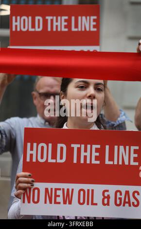 Protest Against Fosil Protesters hold up signs demanding press freedom and protection for ...