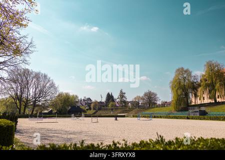 No Racisim Flags Empty horse riding arena with hurdles and flags prepared for a ...