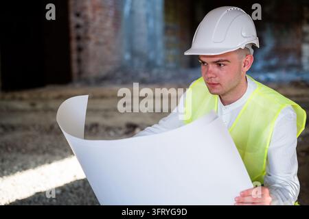 Furing Layout Pln Reviewing architectural floor plans and technical drawings during a ...