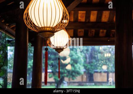 Lantern style ceiling lights inside a traditional building in Asia Stock Photo