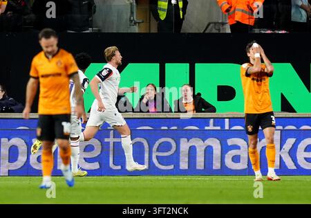 Bolton Wanderers' Sam Dalby (centre) celebrates after scoring his sides ...
